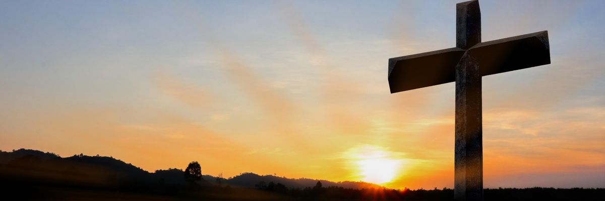 A crucifix at sunset