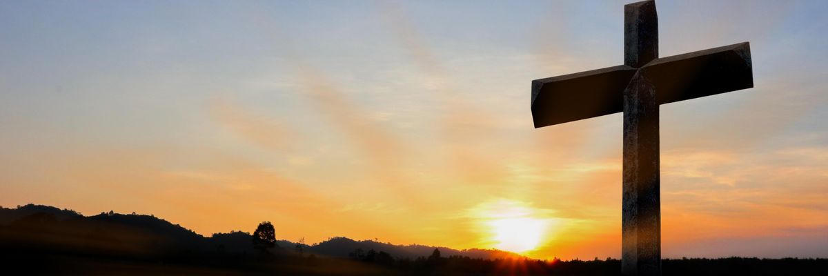A crucifix at sunset