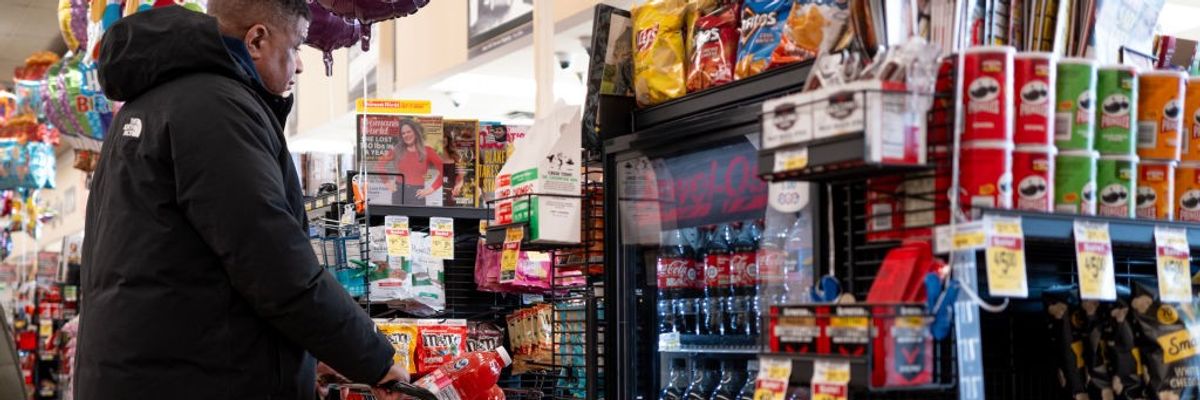 A customer prepares to check out at a grocery store