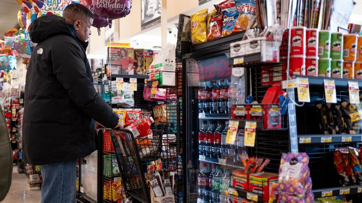 A customer prepares to check out at a grocery store