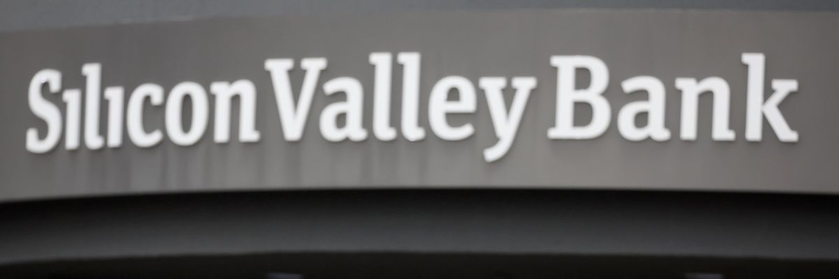 A customer stands outside of a shuttered Silicon Valley Bank