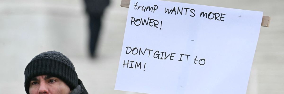 A demonstrator holds up a sign outside the US Supreme Court