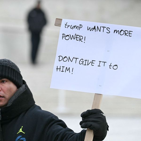 A demonstrator holds up a sign outside the US Supreme Court
