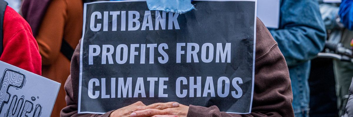 A demonstrator is seen holding a sign at a climate protest in Manhattan