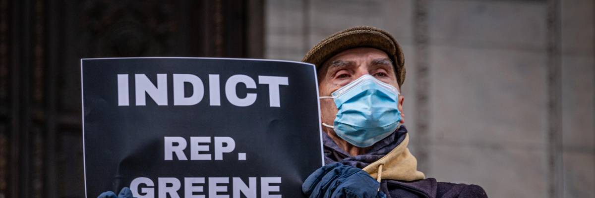 A demonstrator participates in a protest on January 6, 2022
