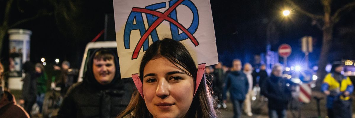 A demonstrator poses for a photo during a protest