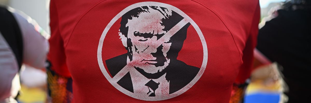 A demonstrator protests US military attacks