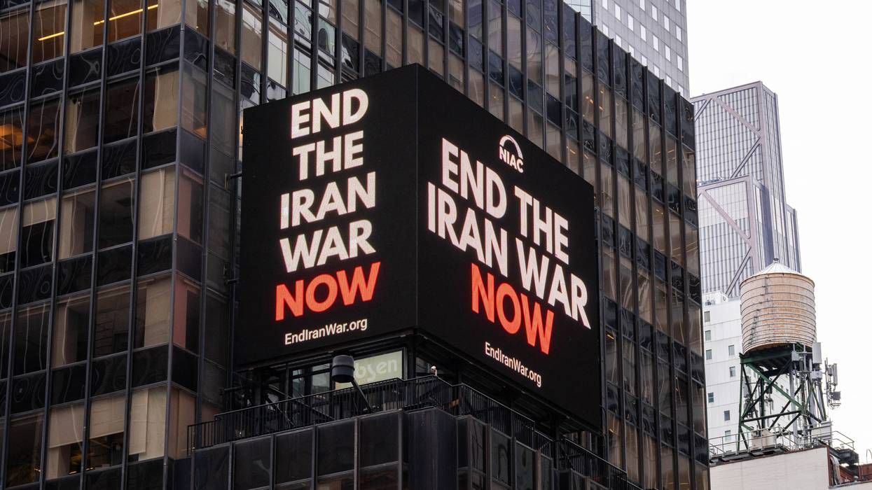 A digital billboard in Times Square says "End the Iran War Now"