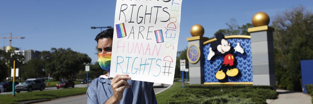 A Disney employee protests outside Walt Disney World