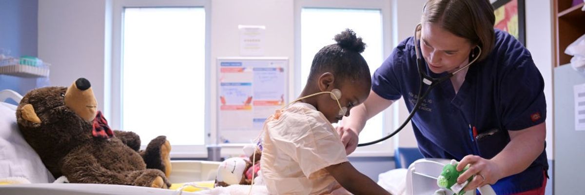A doctor examines a 6-year-old patient