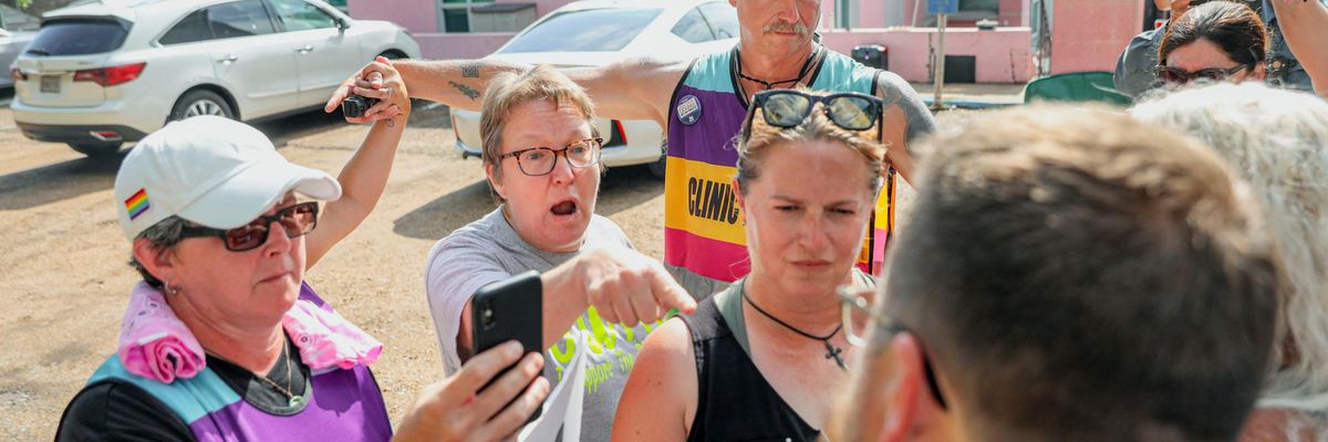 A doctor yells at an anti-abortion protestor