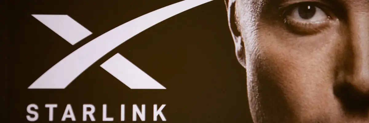 A double exposure photograph shows a portrait of Elon Musk and the Starlink company logo