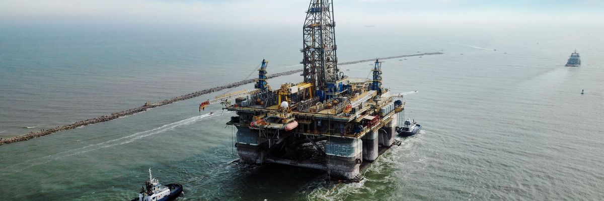 A drilling platform is pulled into the Gulf of Mexico