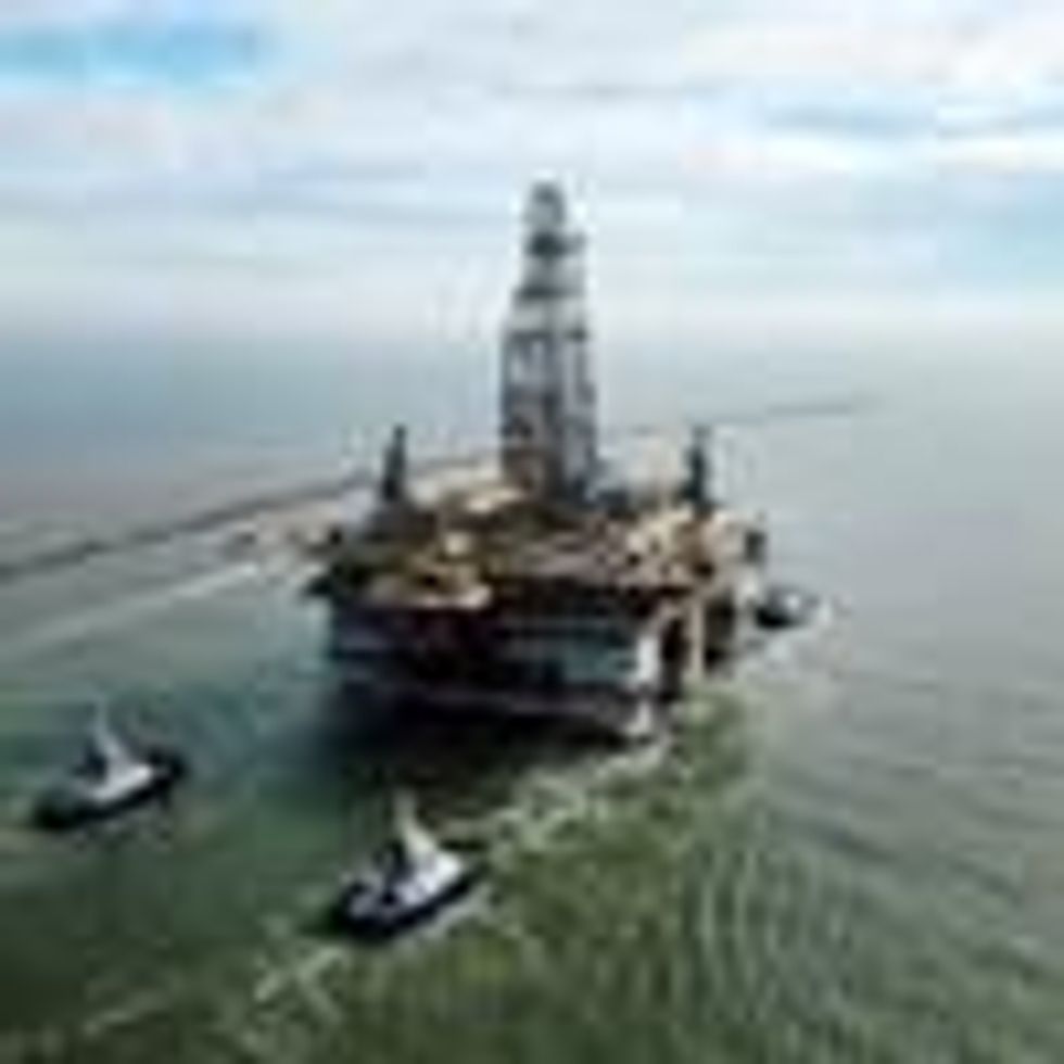 A drilling platform is pulled into the Gulf of Mexico