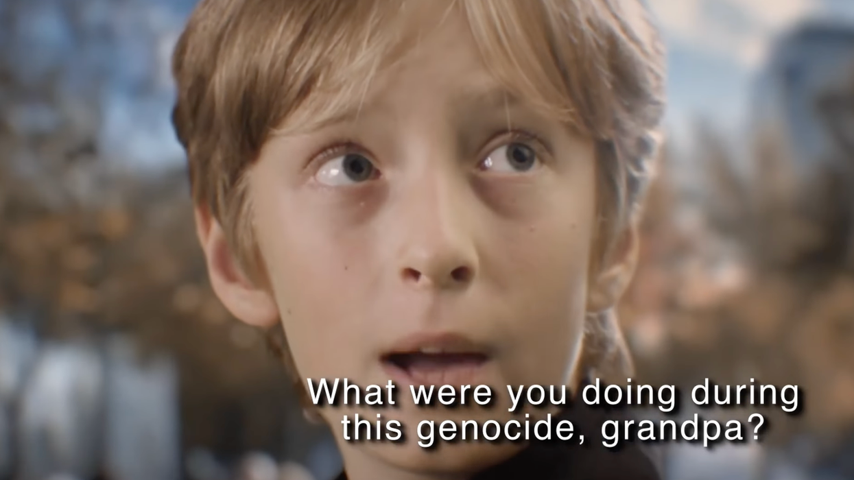 A European boy in a video set in 2040 asks, "What were you doing during this genocide, grandpa?"