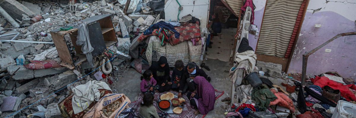 A family breaks the Ramadan fast amid rubble in Gaza.