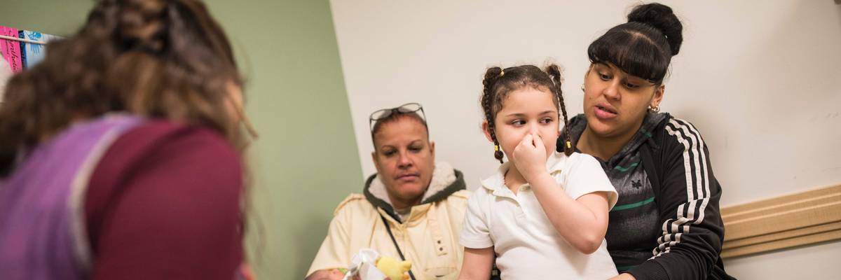 A family goes to the pediatrician.