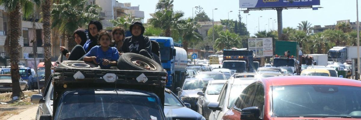 A family is pictured waiting in a traffic jam in southern Lebanon