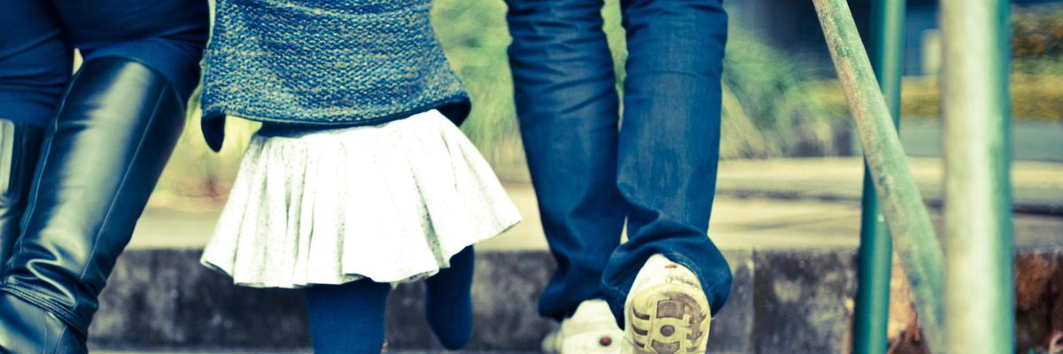 A family walking up steps