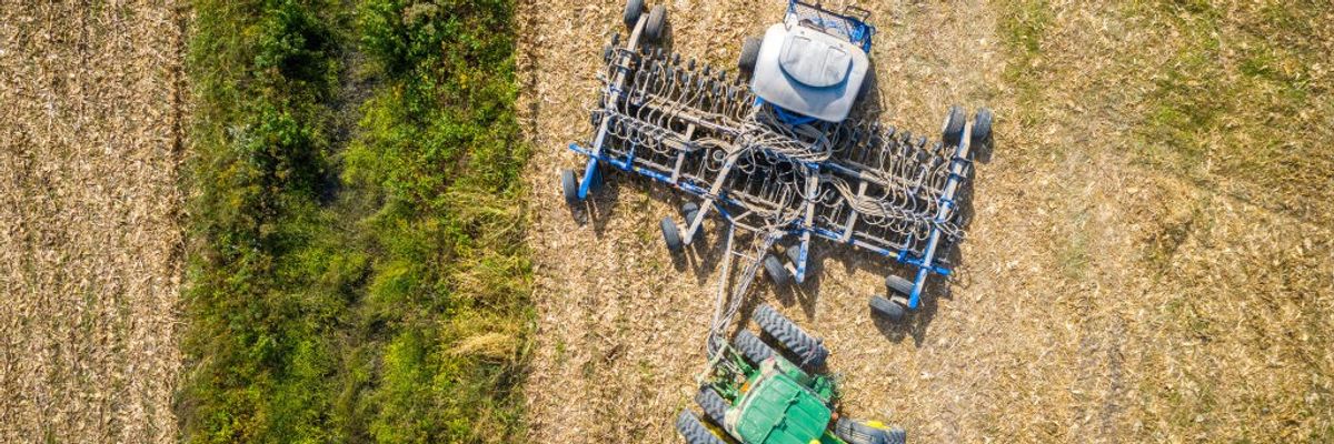 A farmer plants cover crops following a corn harvest in Maryland on October 9, 2020.