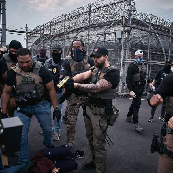 A federal agent threatens to Taser protesters during a protest in Newark, NJ.