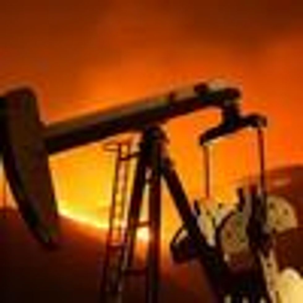A fire burns near an oil well in California