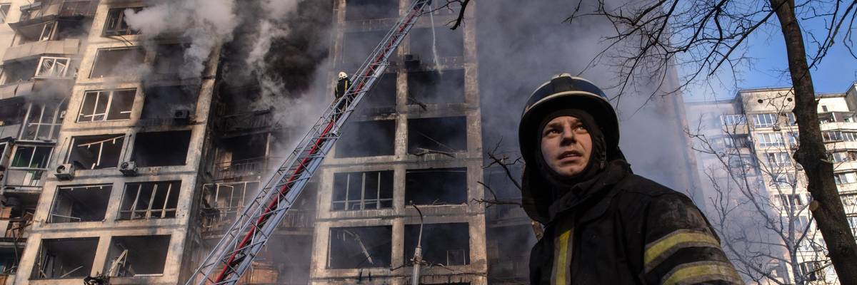 A firefighter seen near a residential building hit by a Russian strike