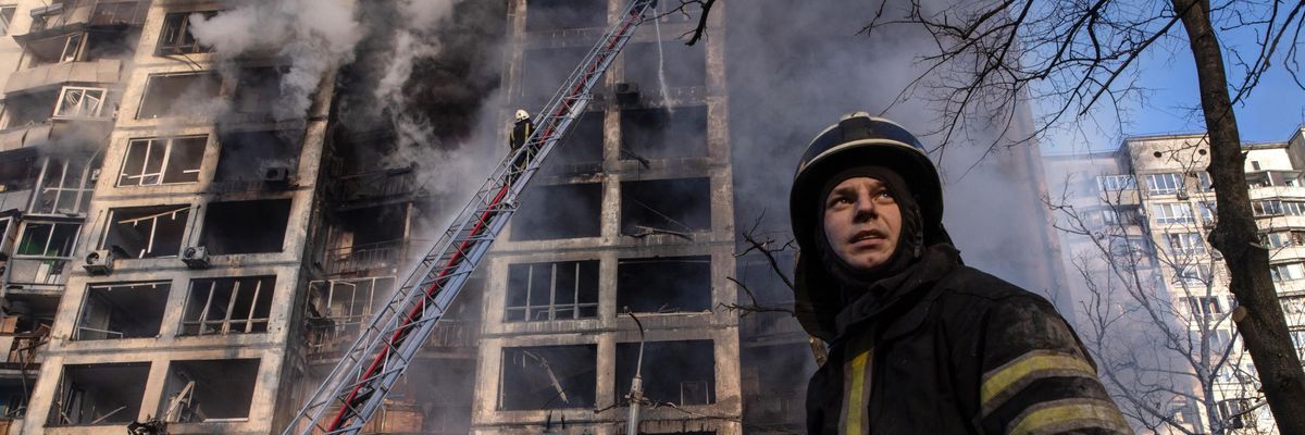 A firefighter seen near a residential building hit by a Russian strike