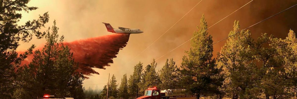 A firefighting tanker drops retardant over the Grandview Fire on July 11, 2021, northeast of Sisters, Oregon. (Photo: Oregon Department of Forestry via Getty Images)