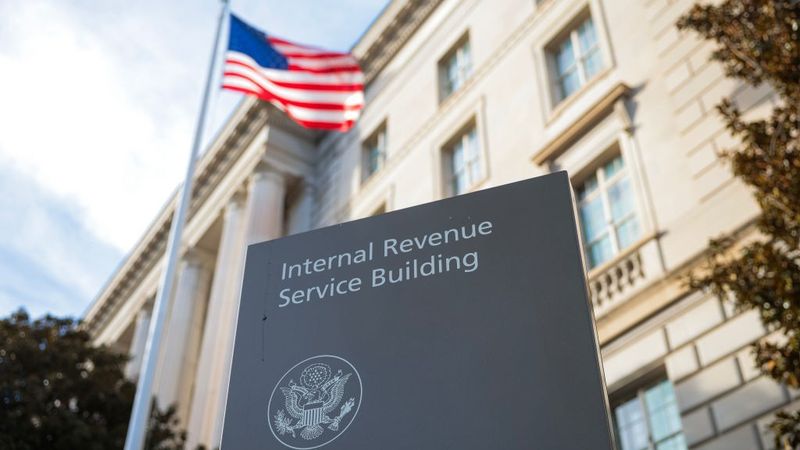 A flag waves above the Internal Revenue Service Headquarters In Washington, D.C.