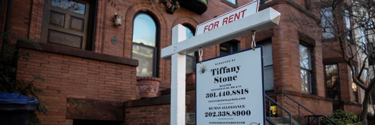 a for rent sign outside a Washington, D.C. brownstone home