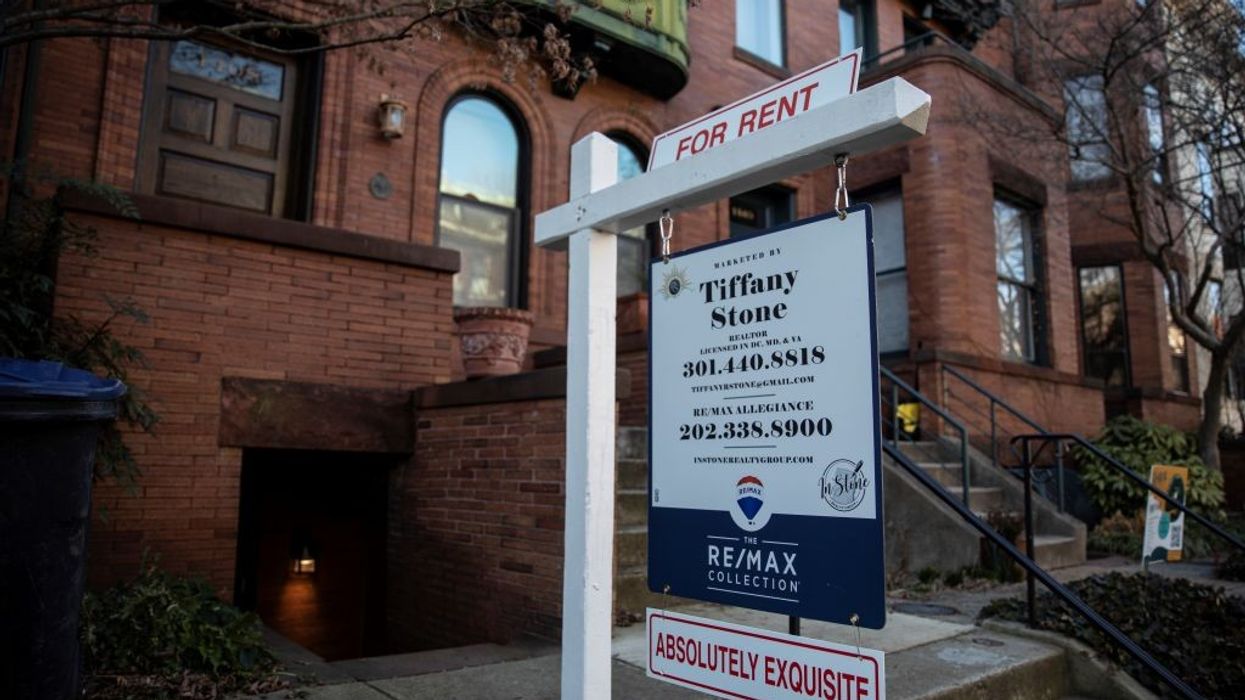 a for rent sign outside a Washington, D.C. brownstone home