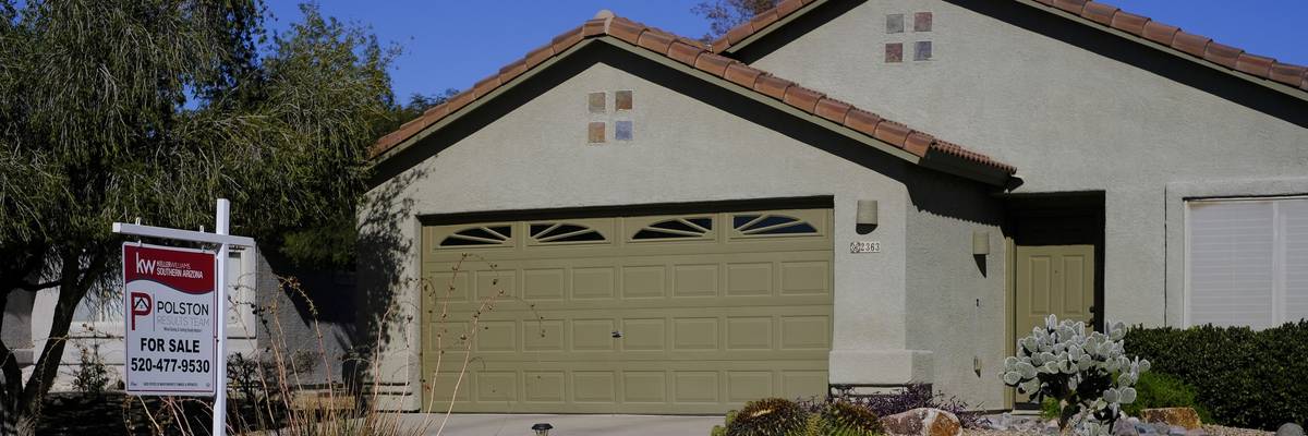 A ''For Sale'' sign is seen outside a residential home