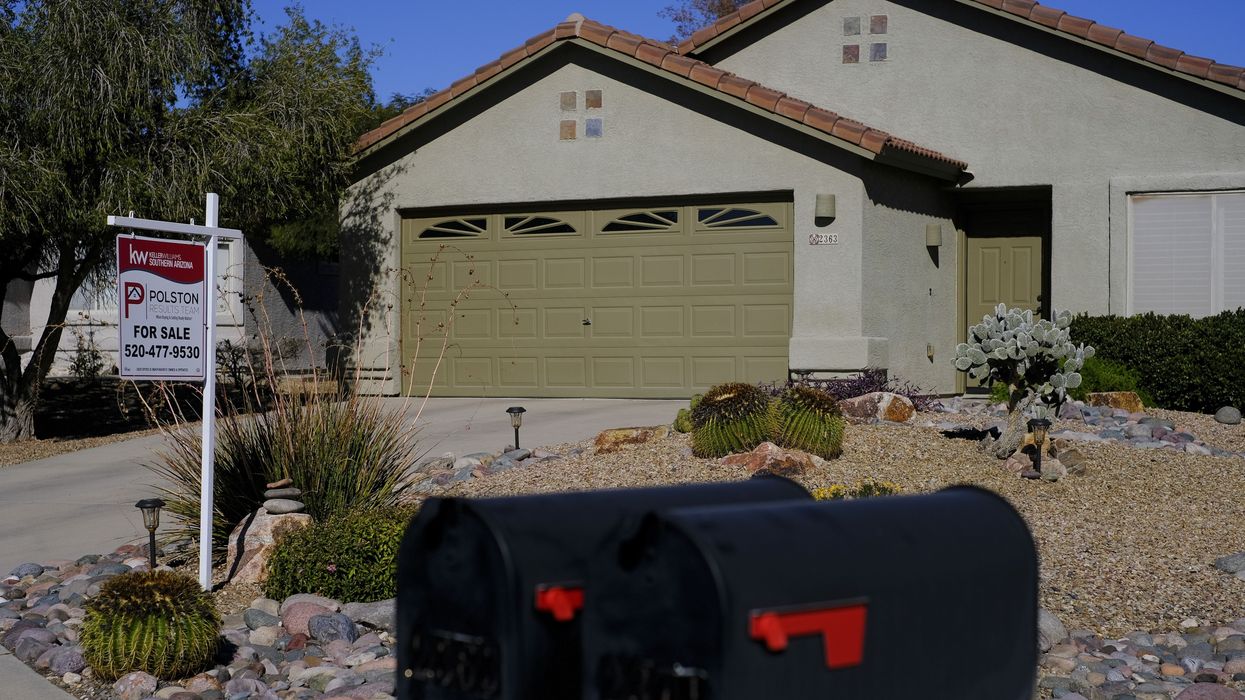 A ''For Sale'' sign is seen outside a residential home
