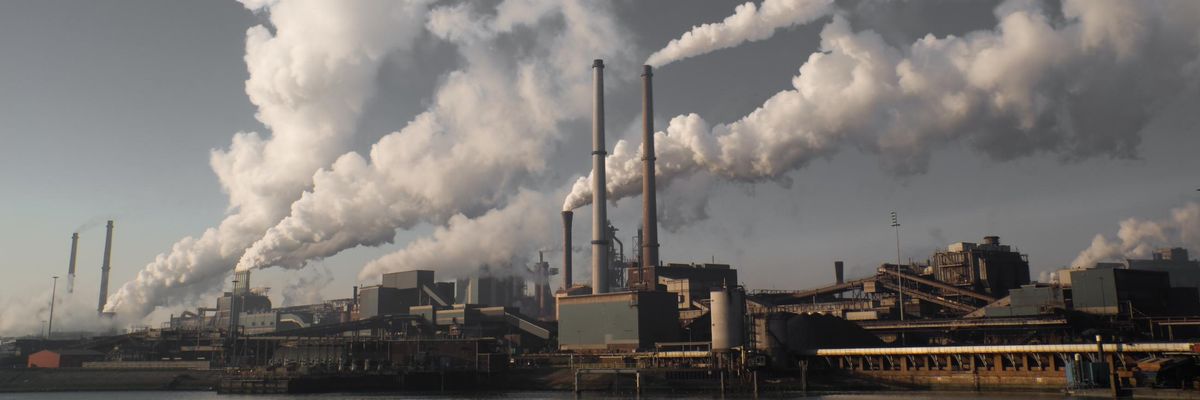 A fossil fuel plant releases smoke