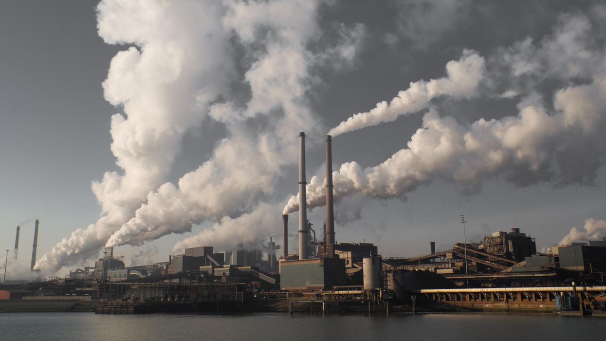 A fossil fuel plant releases smoke