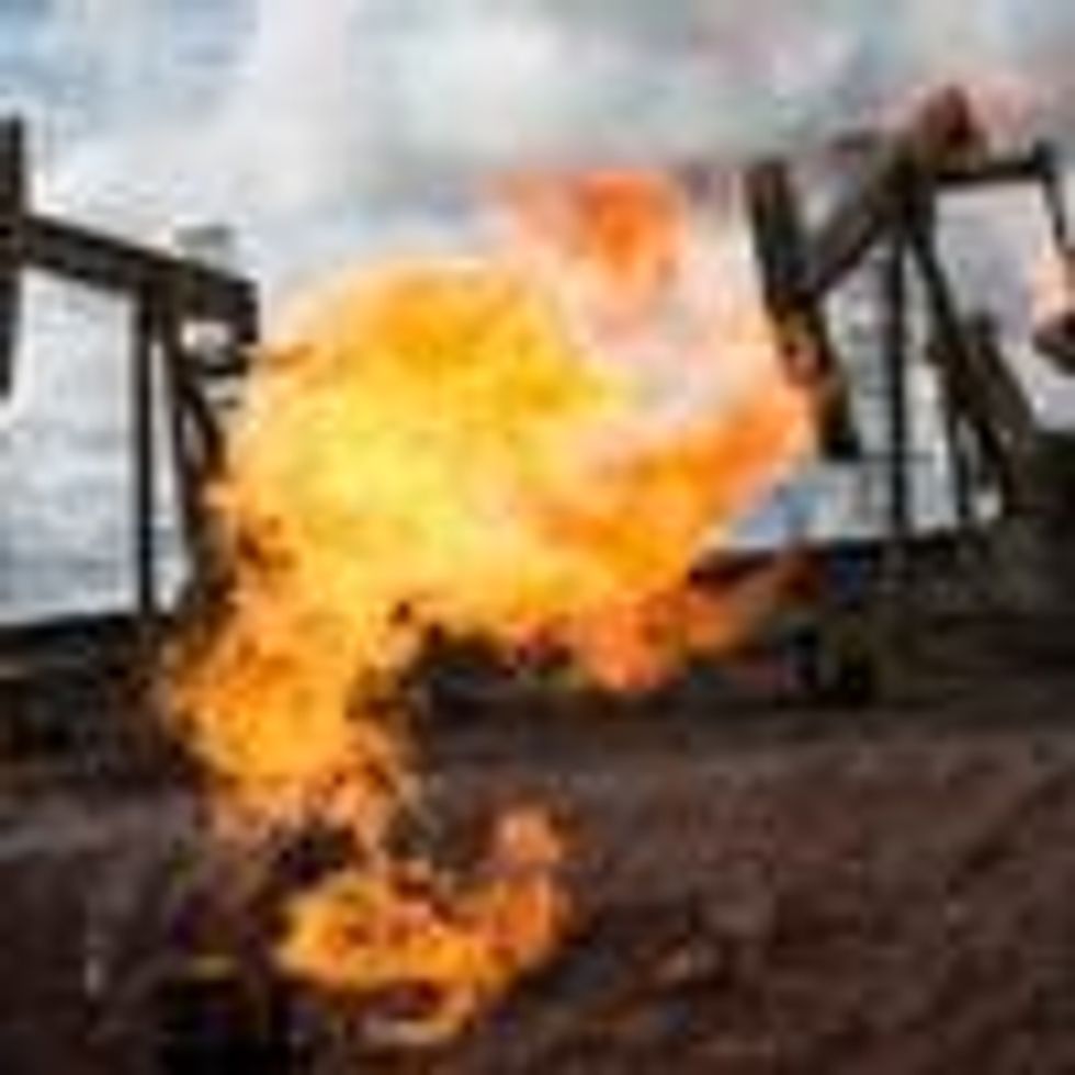 A gas flare is seen at an oil well site on July 26, 2013 outside Williston, North Dakota. (Photo: Andrew Burton via Getty Images)