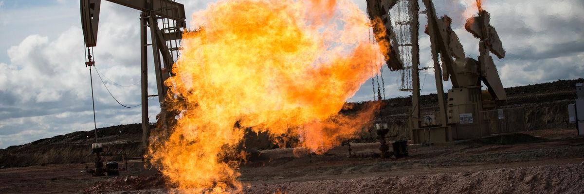 A gas flare is seen at an oil well site on July 26, 2013 outside Williston, North Dakota. (Photo: Andrew Burton via Getty Images)