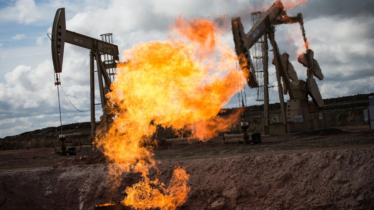 A gas flare is seen at an oil well site on July 26, 2013 outside Williston, North Dakota. (Photo: Andrew Burton via Getty Images)