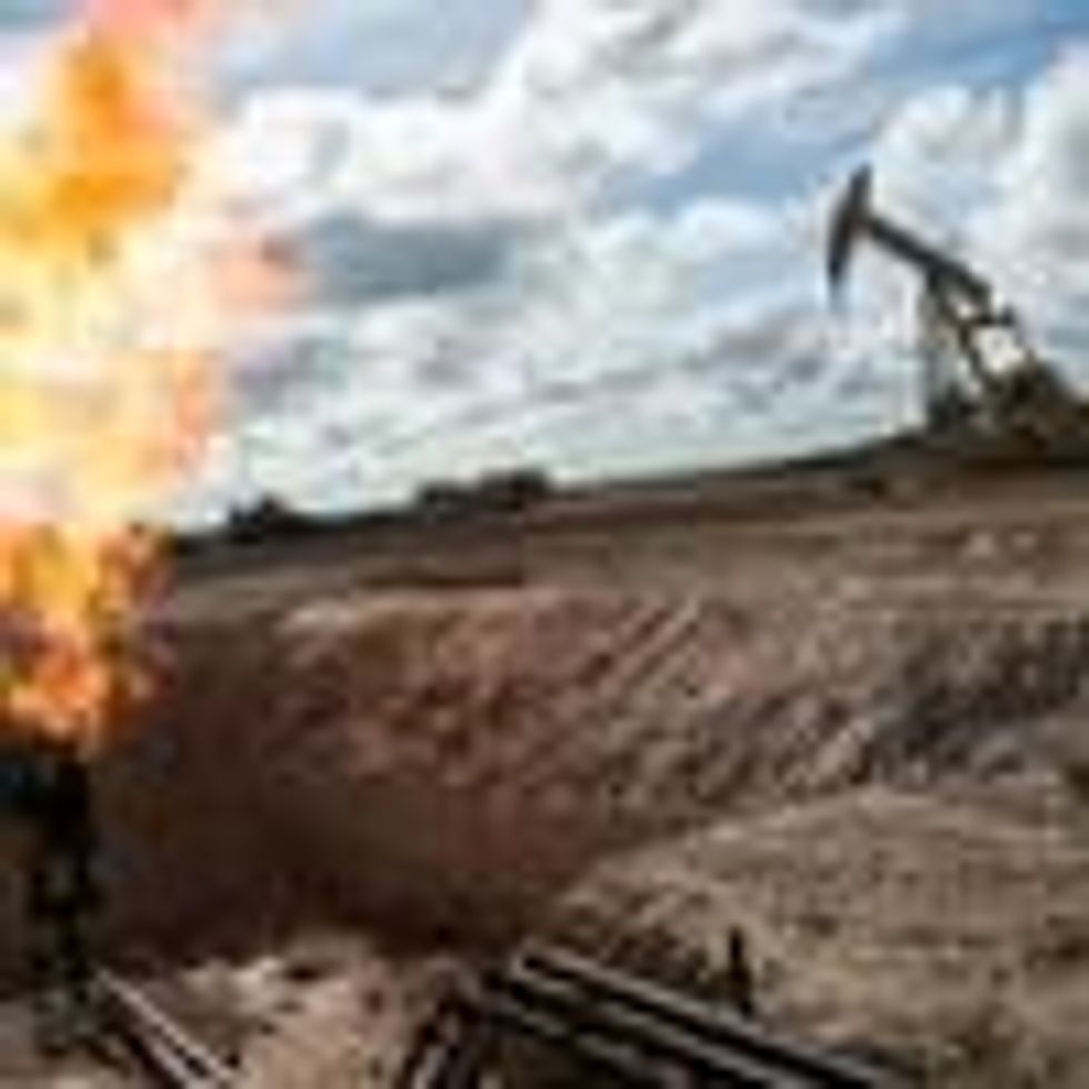 A gas flare is seen at an oil well site on outside Williston, North Dakota. (Photo: Andrew Burton/Getty Images)