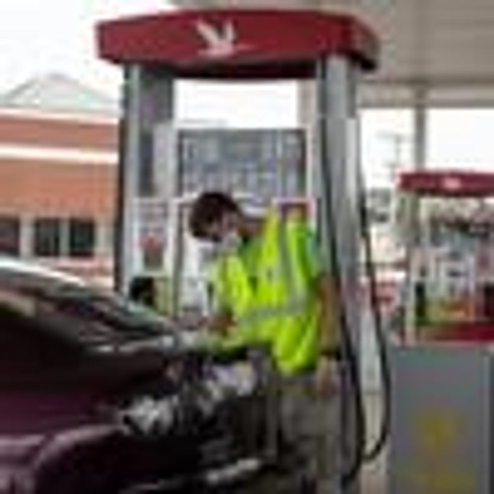 A gas station attendant pumps gas on August 15, 2020 in Somers Point, New Jersey. (Photo: Alexi Rosenfeld via Getty Images)