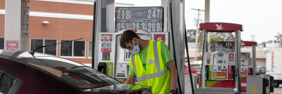 A gas station attendant pumps gas on August 15, 2020 in Somers Point, New Jersey.