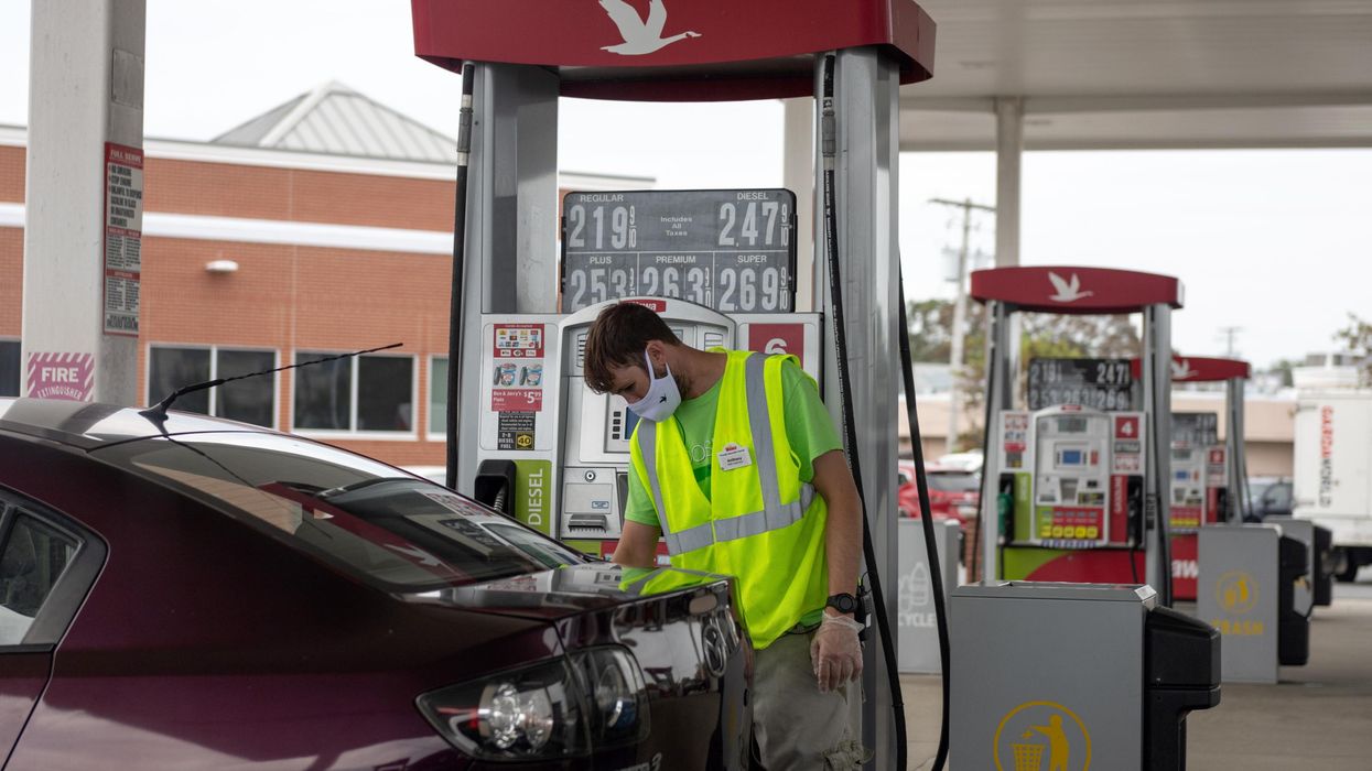 A gas station attendant pumps gas on August 15, 2020 in Somers Point, New Jersey.