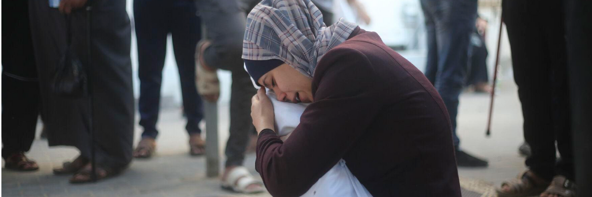 A Gazan woman mourns her dead child.