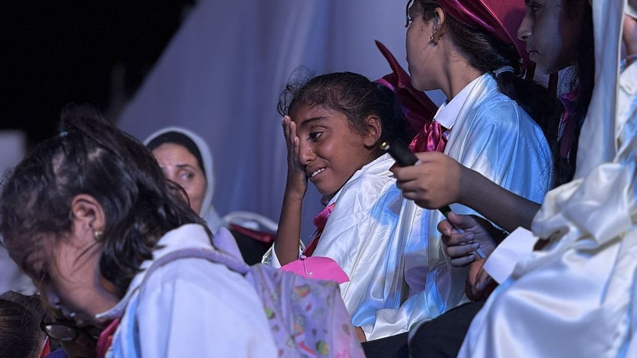 A girl cries during a graduation ceremony at a school for Gaza orphans