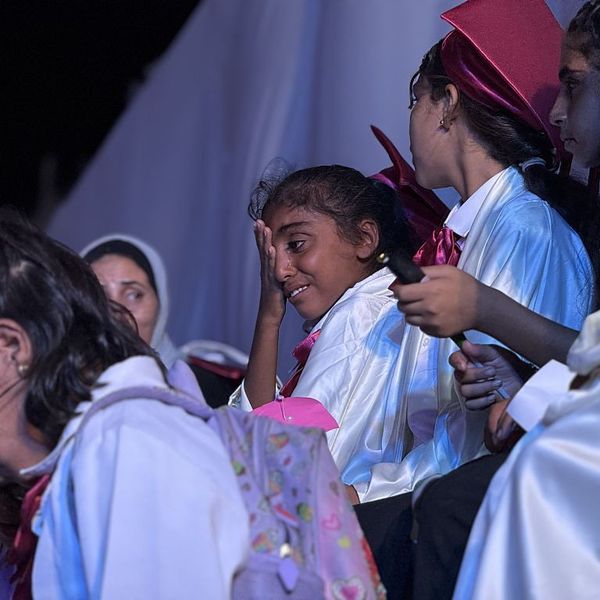 A girl cries during a graduation ceremony at a school for Gaza orphans