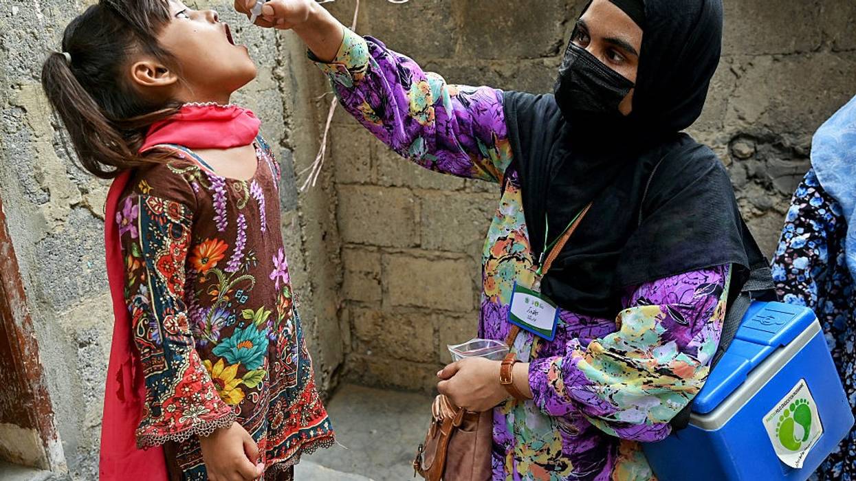 A girl gets a polio vaccine dose in Pakistan