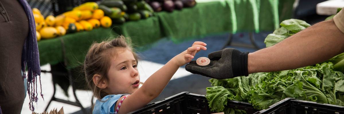 A girl pays using EBT