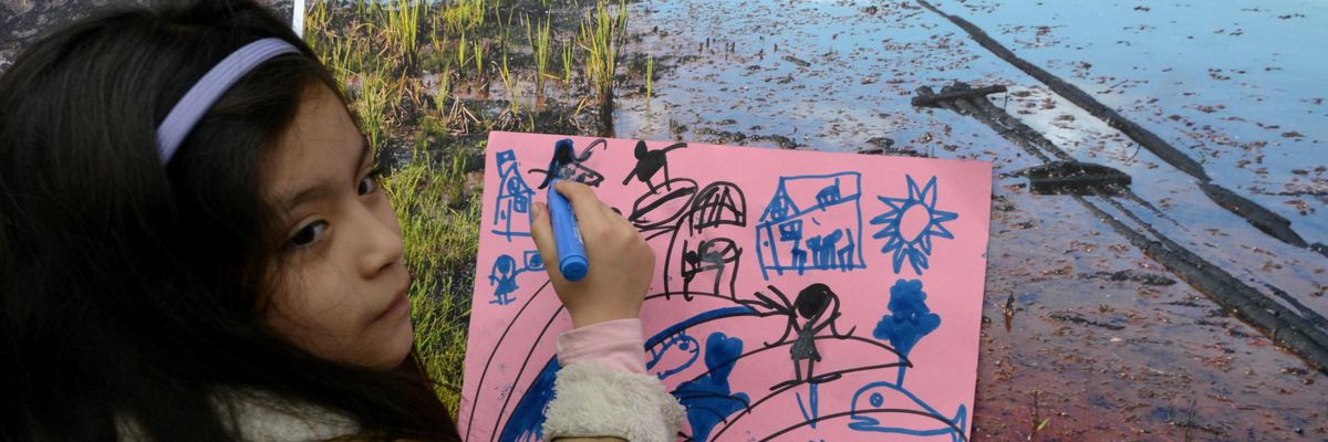 A girl takes part in an anti-pipeline protest in Peru