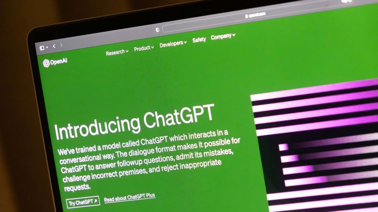 A green computer screen with the words "Introducing ChatGPT" in white.